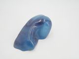 a picture of a piece of blue stone on a white surface