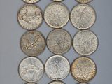 a close up of a bunch of coins sitting on top of a table