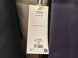 a label on a suit jacket that says noc