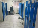 several blue lockers in the hallway of a building