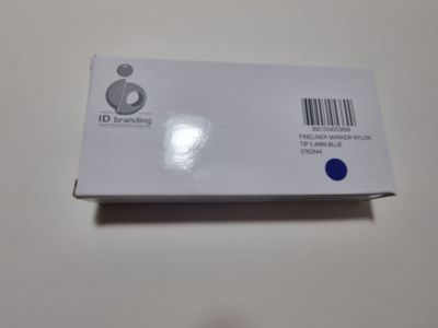 someone is holding a white box with a barcode on it