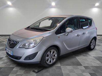 a picture of a silver car parked in a garage