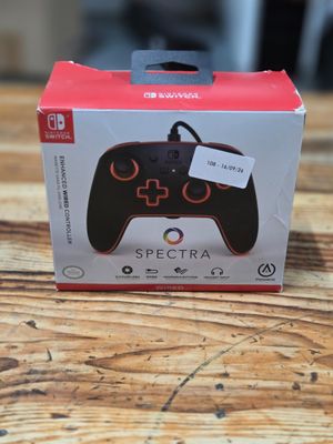 the box of a nintendo wii game controller sitting on a wooden table