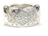 a close up of a diamond ring on a white background