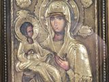 an image of a gold framed icon of the virgin and child