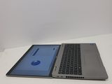 two laptops sitting side by side on a white surface