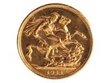 une pièce d'or sur laquelle figure une femme à cheval