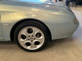 a picture of a car parked in a showroom
