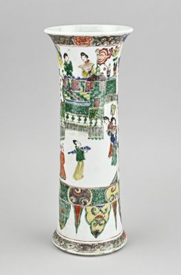 a vase with a painting on it sitting on a table