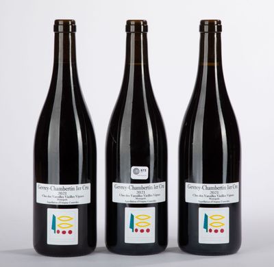 three bottles of wine sitting next to each other on a table