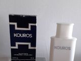 un flacon de Kouros à côté d'une boîte de parfum