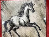 painting of a horse running in the wind in a red frame
