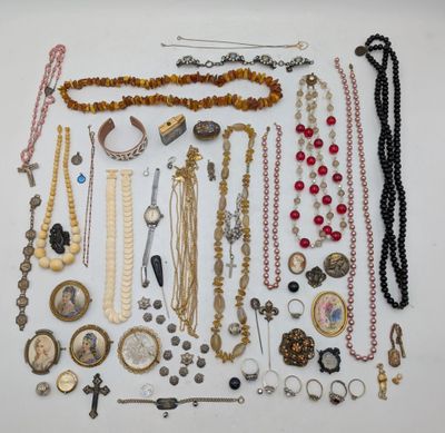 an assortment of assorted necklaces and bracelets on a white surface