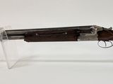 an old gun with a wooden handle on a white background