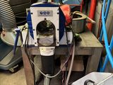 a machine that is sitting on a table in a garage