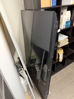 a refrigerator that has a door open in a room