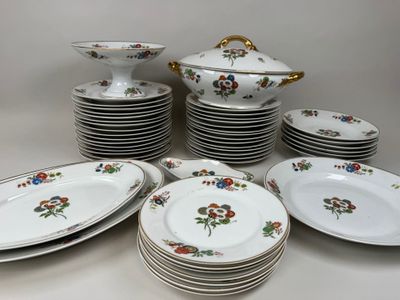 a lot of plates and bowls on the table