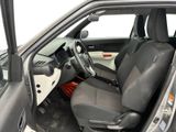 the interior of a car with the door open and the driver ' s seat down