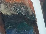 a picture of a piece of rock in a glass case