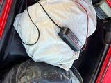 une photo d'un sac de voyage à l'arrière d'une voiture