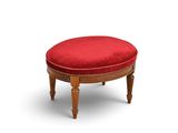une photo d'un pouf rouge avec des pieds en bois et un coussin rouge