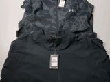 La veste Under Armour est ornée d'un imprimé camouflage.