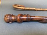 two wooden canes that are sitting on a table