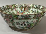 a bowl that has a picture of people in a garden on it