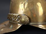 a gold helmet with a lion head on it