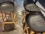 three stools that are sitting in the middle of a room