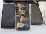 three different types of cigarette cases on a table
