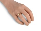 an image of a woman ' s hand with a ring on it ' s finger