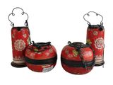 two red vases with chains hanging from them on a white background