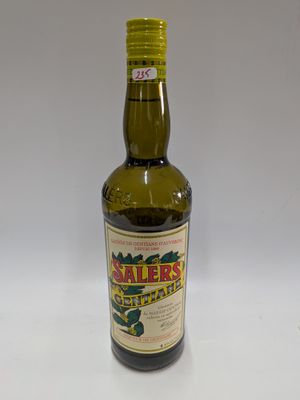 a bottle of olive oil sitting on a table