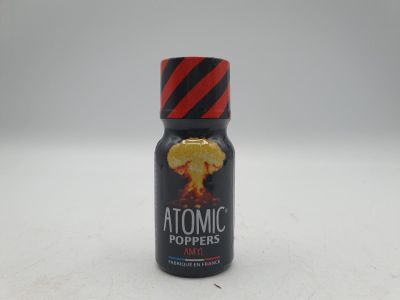 a bottle of atomic pepper sitting on top of a table
