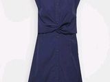 navy blue sleeveless dress with a bow