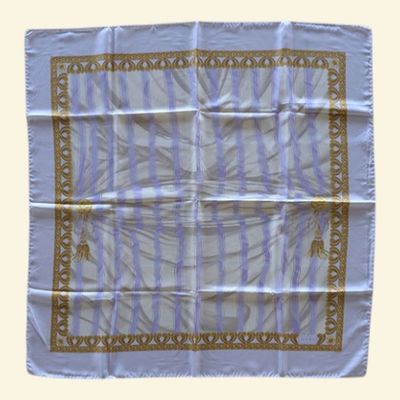 an image of a blue and white scarf with a design on it