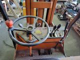steering wheel of a forklift truck in a workshop with other tools