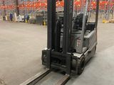 a picture of a forklift in a large warehouse