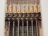 the front cover of a book with a building in the background