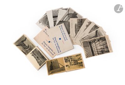 a pile of old photos and old postcards on a white surface