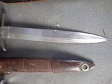 two knives that are sitting next to each other on a table