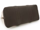 brown leather case with white stitching on it on a white surface