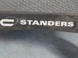 a close up of a sign on the side of a bench