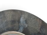 a metal bowl with a clock inside of it