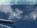 a windshield wiper and a car window wiper on a car