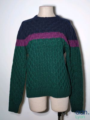 an image of a sweater on a mannequin stand