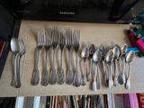a lot of spoons and spoon spoons on a table