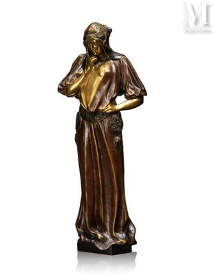 a bronze statue of a woman holding her hands on her chest