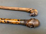 two old canes that are sitting next to each other